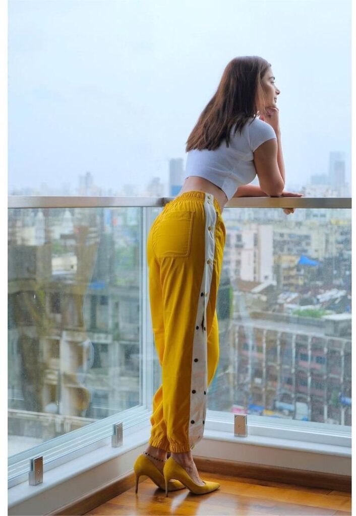 pooja hegde standing in balcony